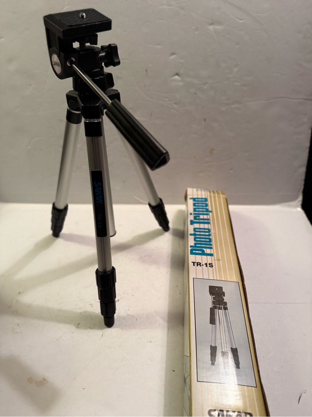 The Sak Silver and Black Camera Tripod with Pan Handle